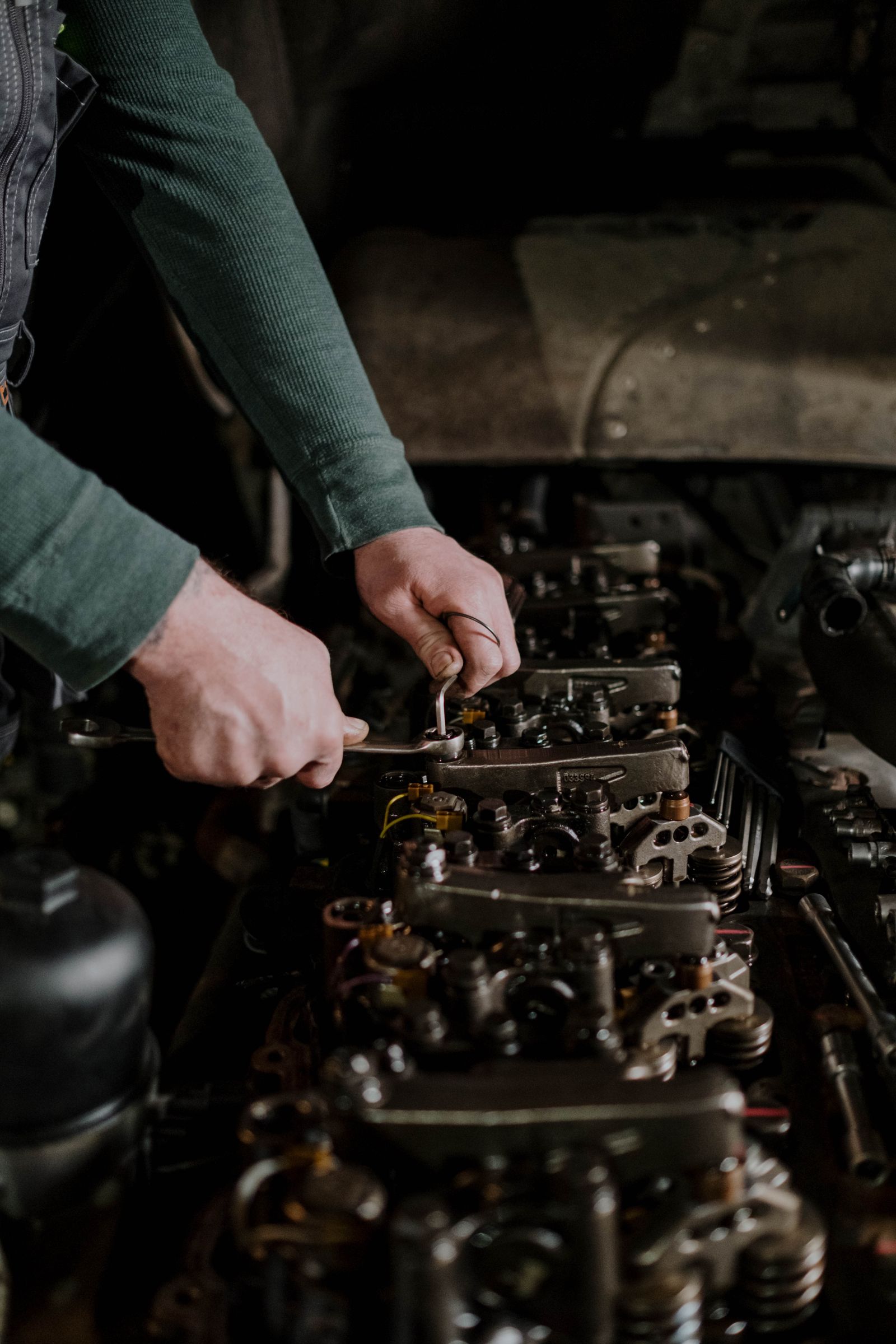 Hands adjusting engine components